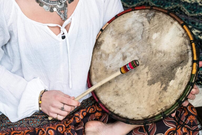 woman beating a drum