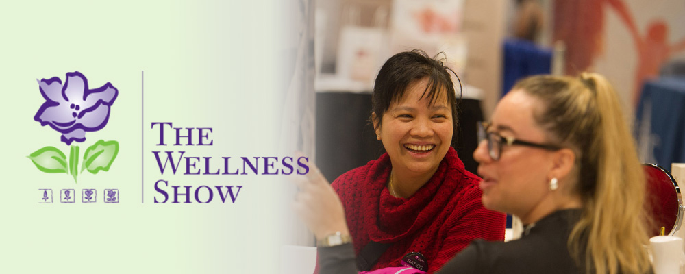 a banner with "the wellness show" logo and an image of two women smiling